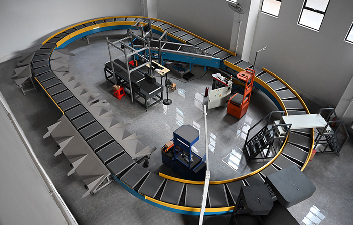 環(huán)型交叉帶分揀機的工作原理、特點及應用